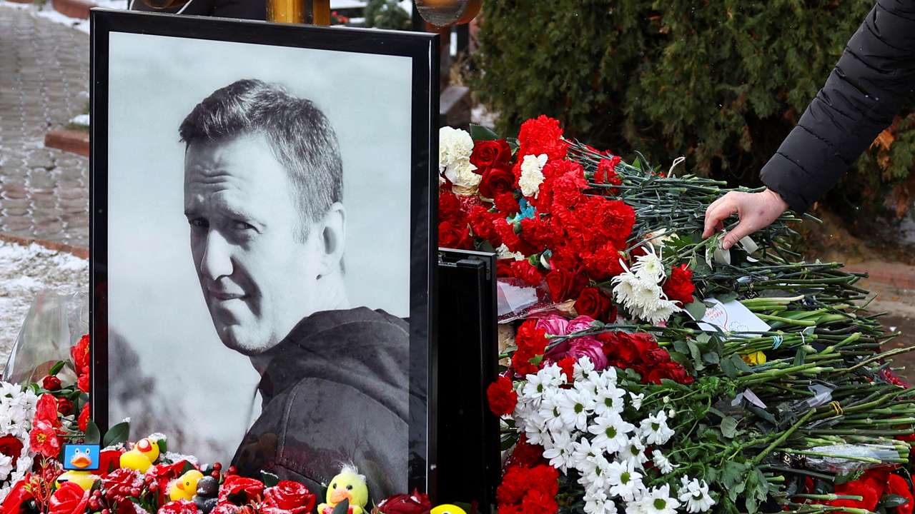 FILE PHOTO: People mark first anniversary of Russian opposition leader Navalny's death at Moscow cemetery