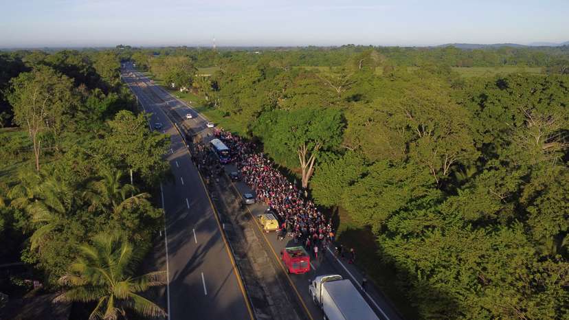 FILE PHOTO: Migrants walk in a caravan in an attempt to reach the U.S. border, in Escuintla