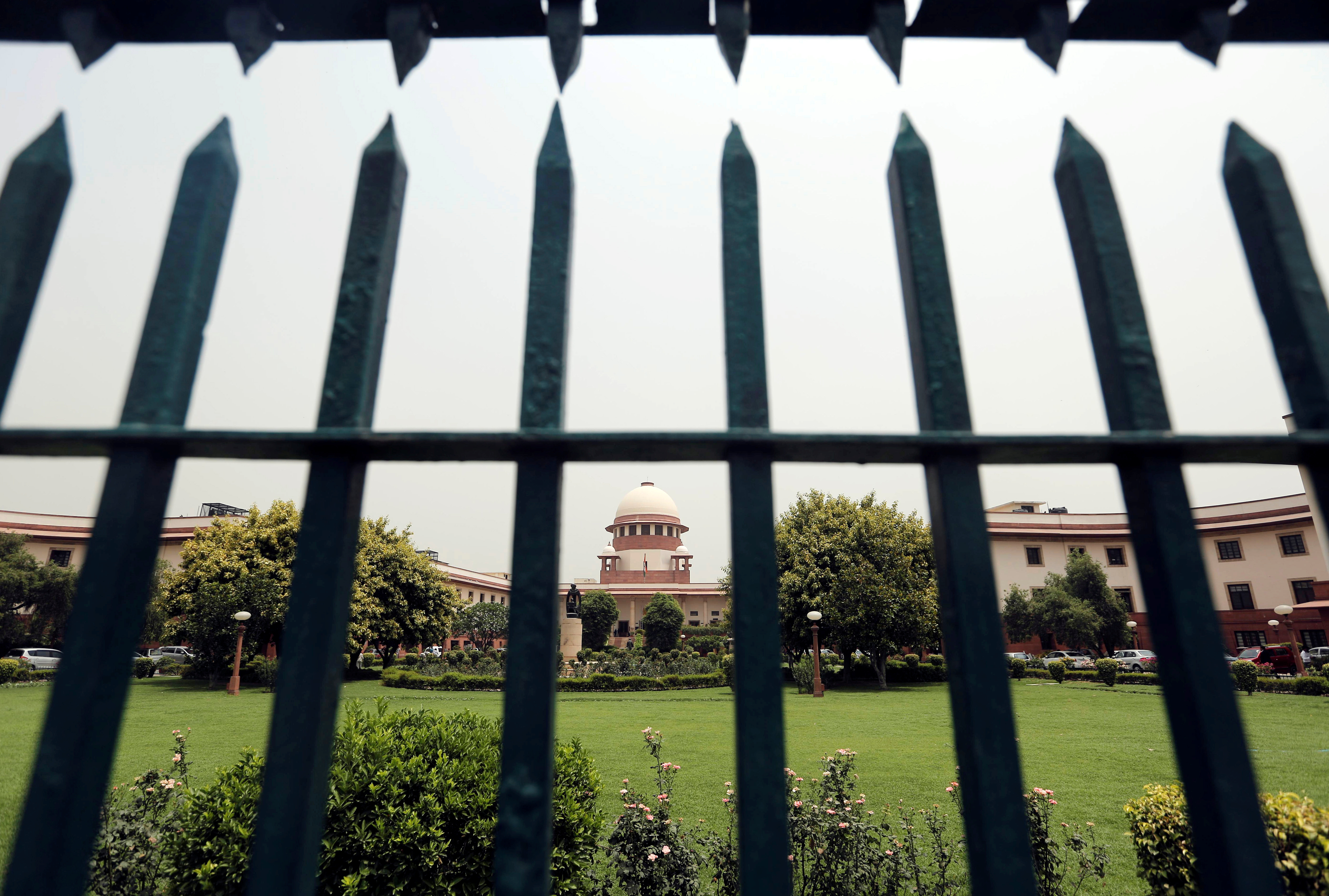India's Supreme Court is pictured through a gate in New Delhi