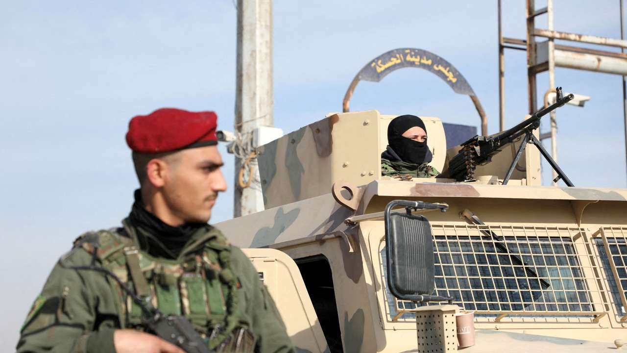 FILE PHOTO: Member of Kurdish-led Syrian Democratic Forces (SDF) stands along a street in Hasakah