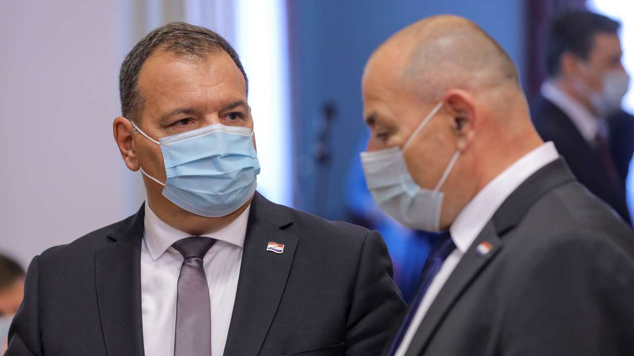 FILE PHOTO: Croatia's Minister of Health Vili Beros speaks with Deputy Prime Minister and Minister of Croatian Veterans Tomo Medved