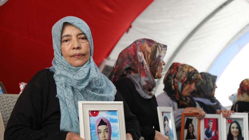 Hatice Levent holds a picture of her daughter Fadime who is believed to have joined the outlawed PKK, during a gathering in Diyarbakir
