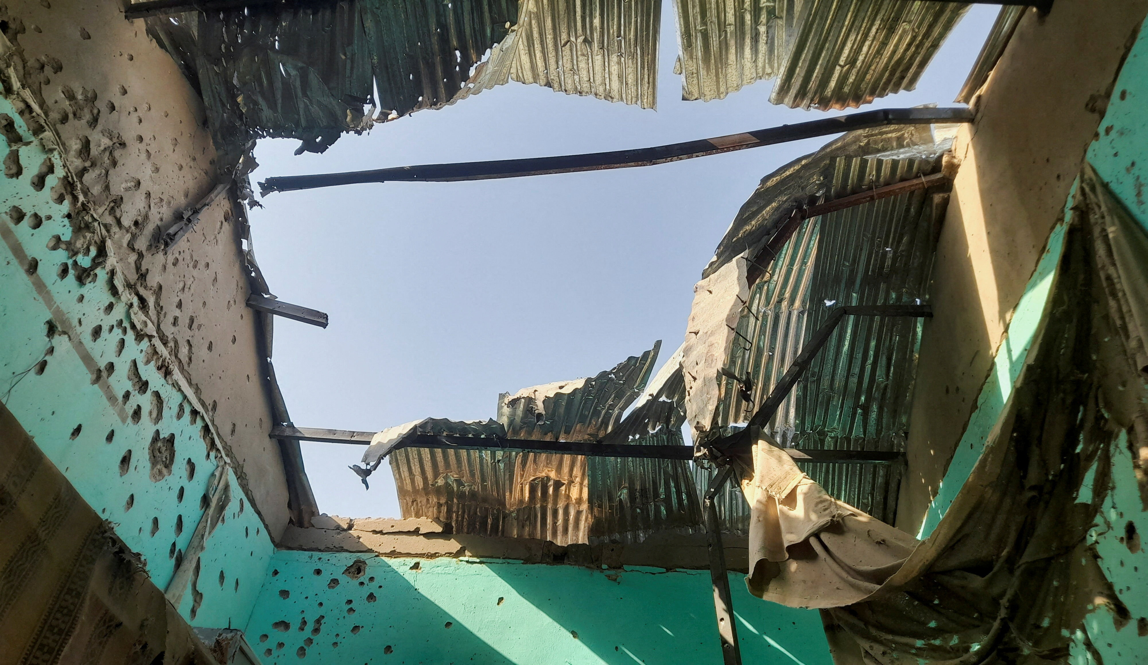 A ceiling damaged by shelling shrapnel at a displaced persons center in El Fasher