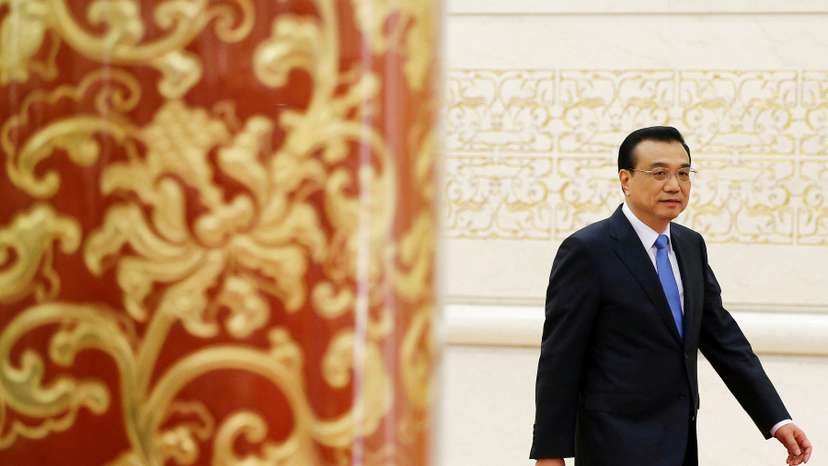 FILE PHOTO: China's Premier Li Keqiang arrives for a news conference after the closing ceremony of China's National People's Congress (NPC) at the Great Hall of the People in Beijing