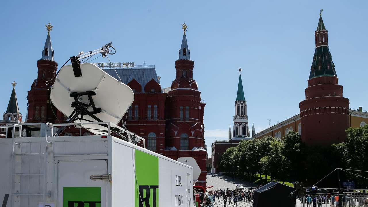 Vehicles of Russian state-controlled broadcaster Russia Today are seen near the Red Square in central Moscow