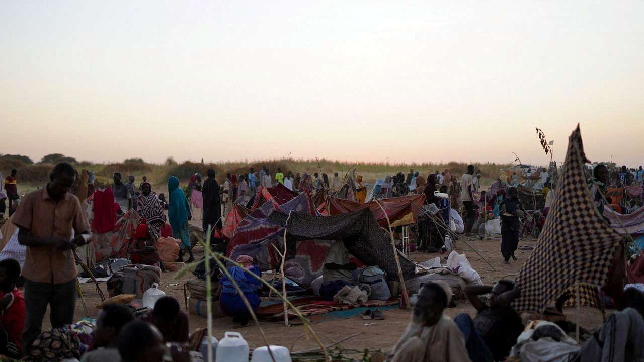Displaced people, who fled from al-Fashir, spend time at a camp in Tawila