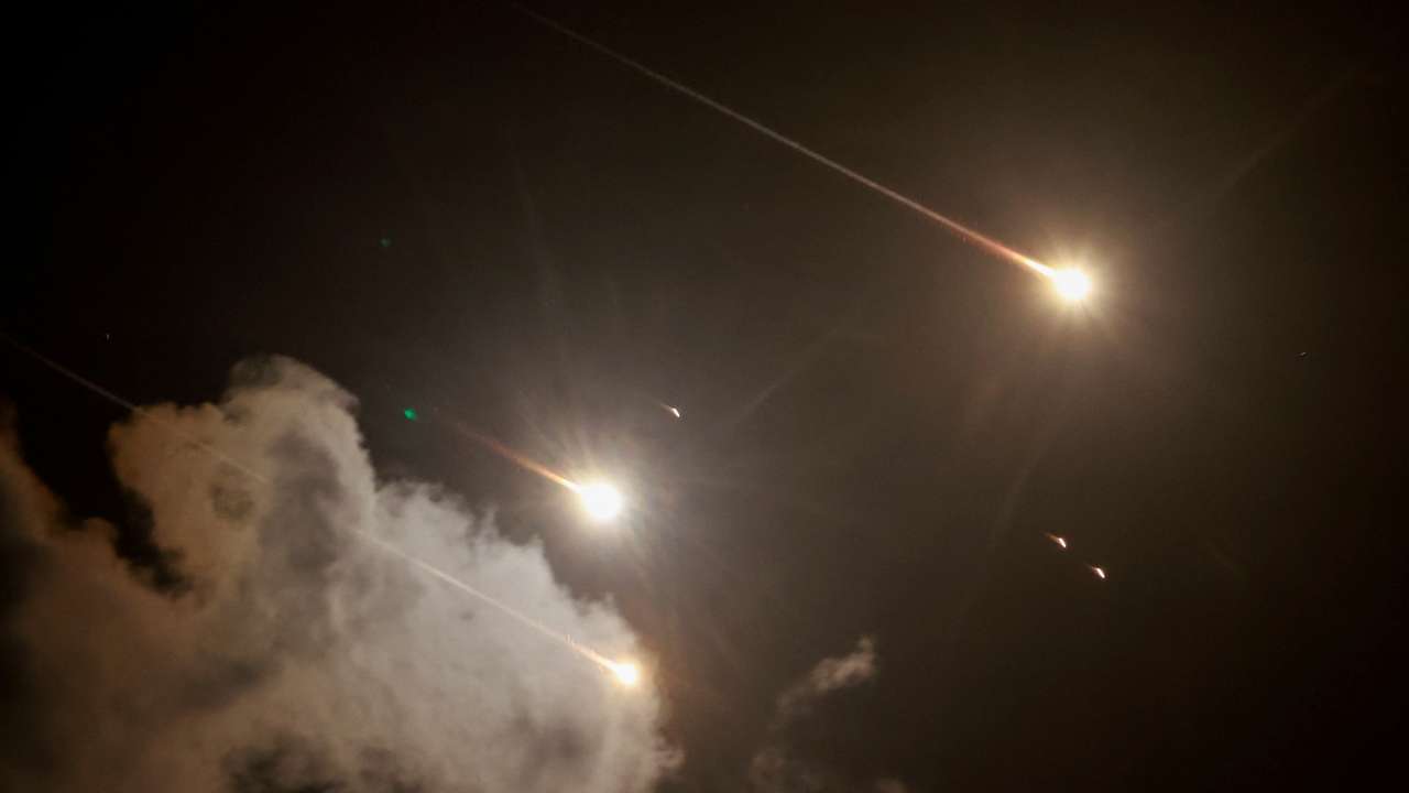 FILE PHOTO: Projectiles are seen in the sky after Iran fired a salvo of ballistic missiles, amid cross-border hostilities between Hezbollah and Israel, as seen from Tel Aviv