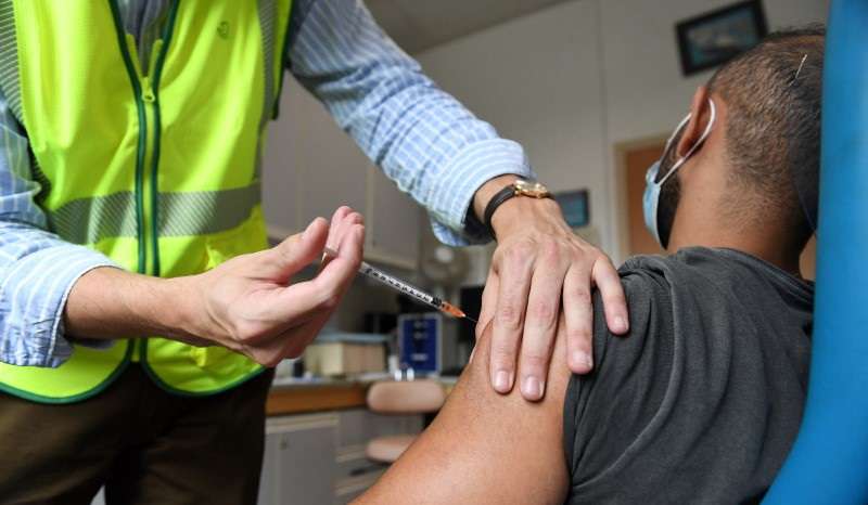 A man receives a dose of the mpox vaccine at the Edison municipal vaccination centre in Paris