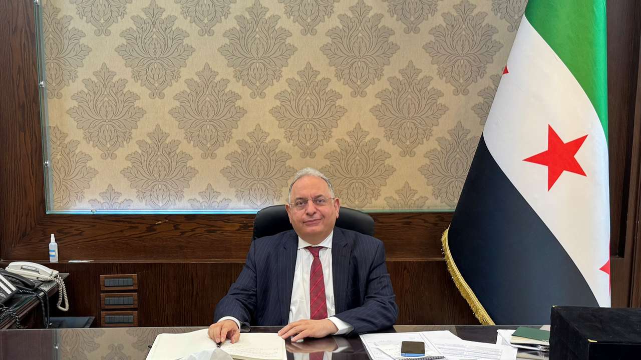 Syrian Finance Minister Yisr Barnieh attends an interview with Reuters at his office at the finance ministry in Damascus