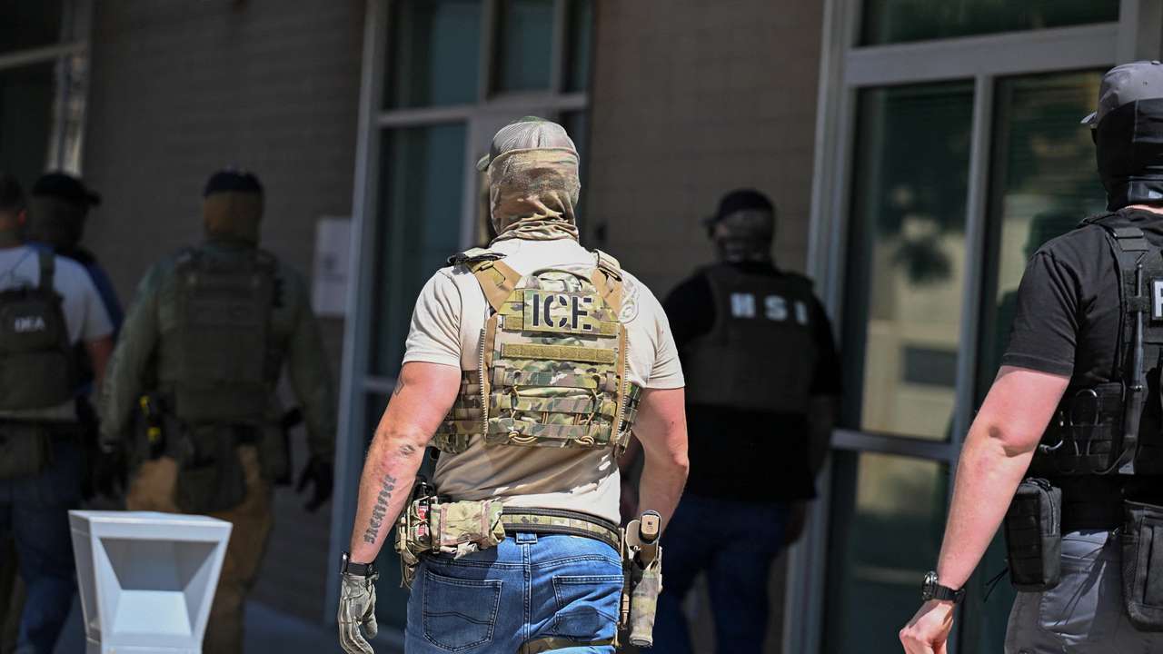 Law enforcement officers, including HSI and ICE agents, take people into custody at an immigration court in Phoenix