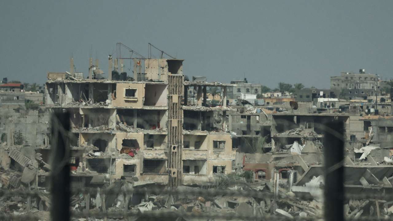 Remains of destroyed buildings in Gaza, amid the ongoing conflict between Hamas and Israel, are pictured through the Egypt-Gaza border, in Rafah