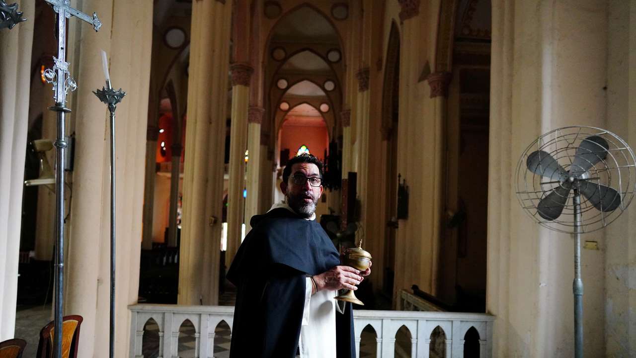 Priest Lester Zayas prepares the church for the Holy Week celebrations in Havana