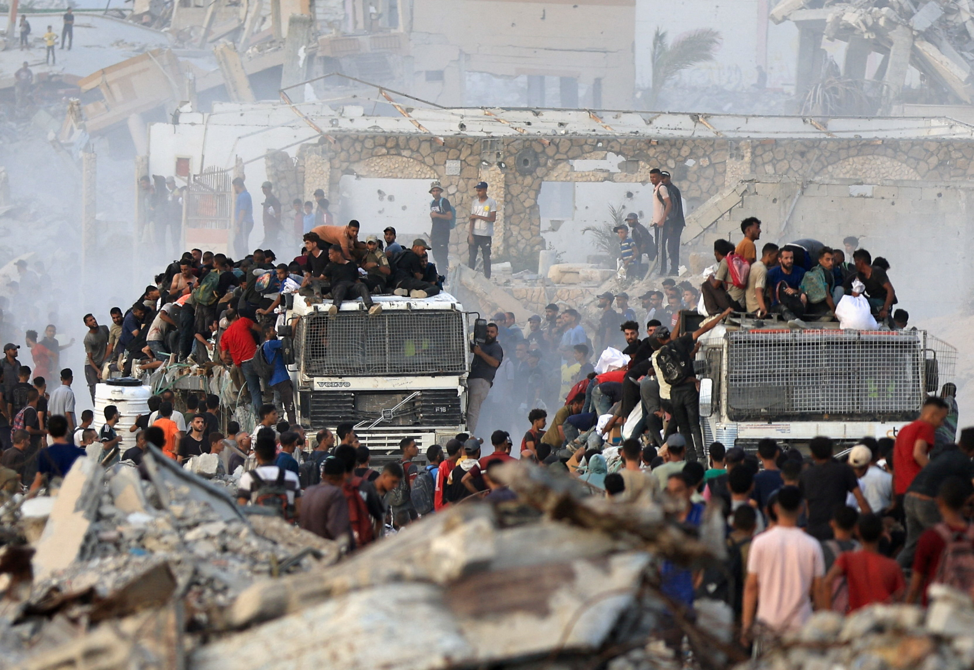 Palestinians receive aid supplies in Beit Lahia