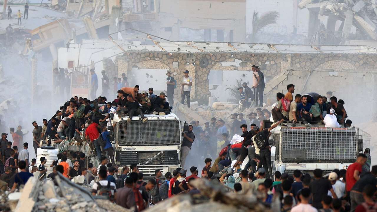 Palestinians receive aid supplies in Beit Lahia