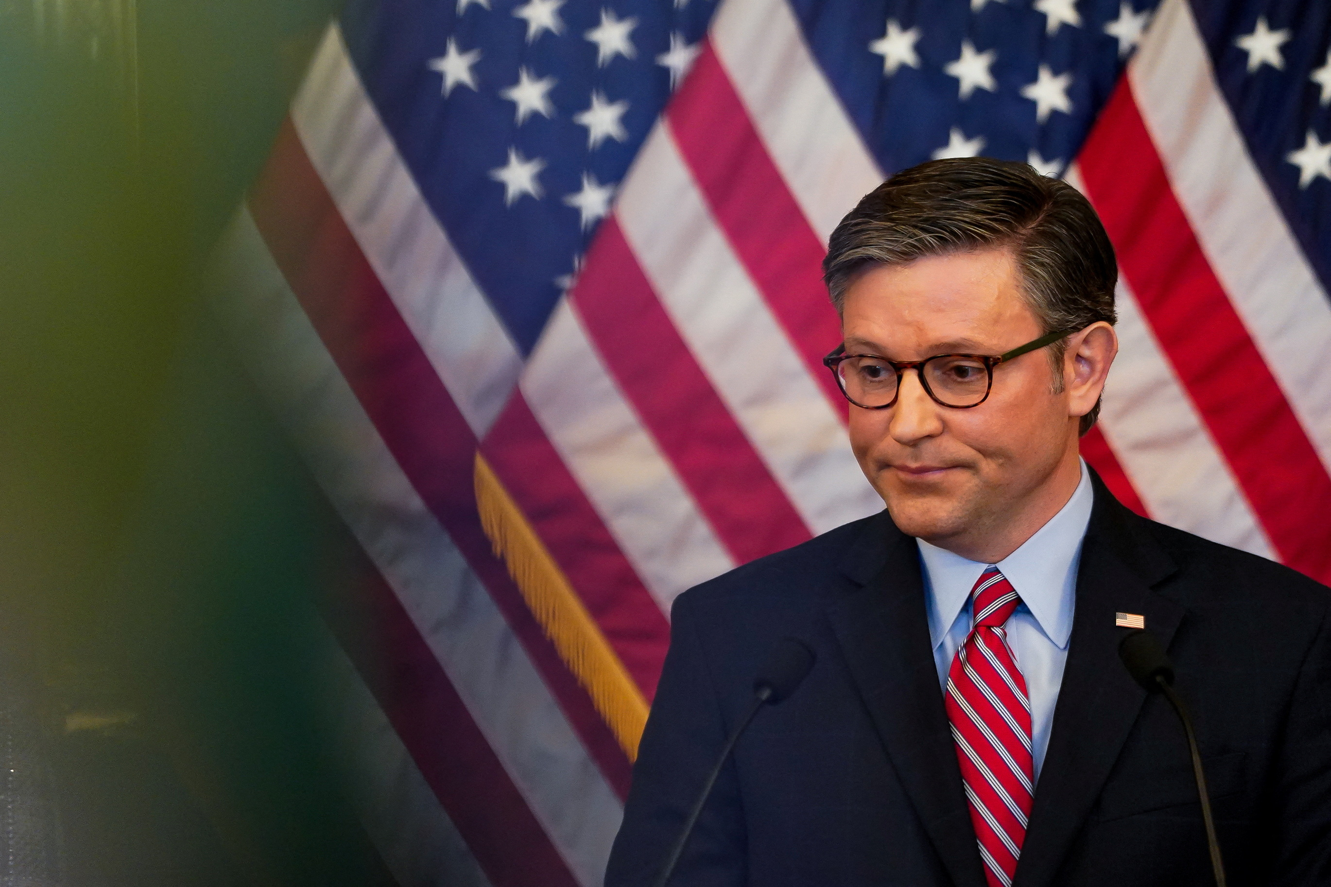 U.S. House Speaker Mike Johnson (R-LA) addresses questions about the pending vote to expel U.S. Rep. George Santos (R-NY) in Washington