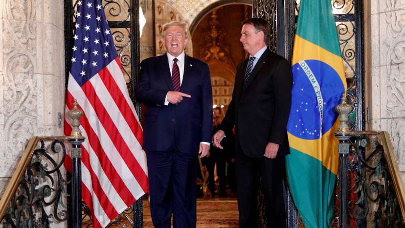 FILE PHOTO: U.S. President Donald Trump participates in a working dinner with Brazilian President Jair Bolsonaro at the Mar-a-Lago resort in Palm Beach, Florida