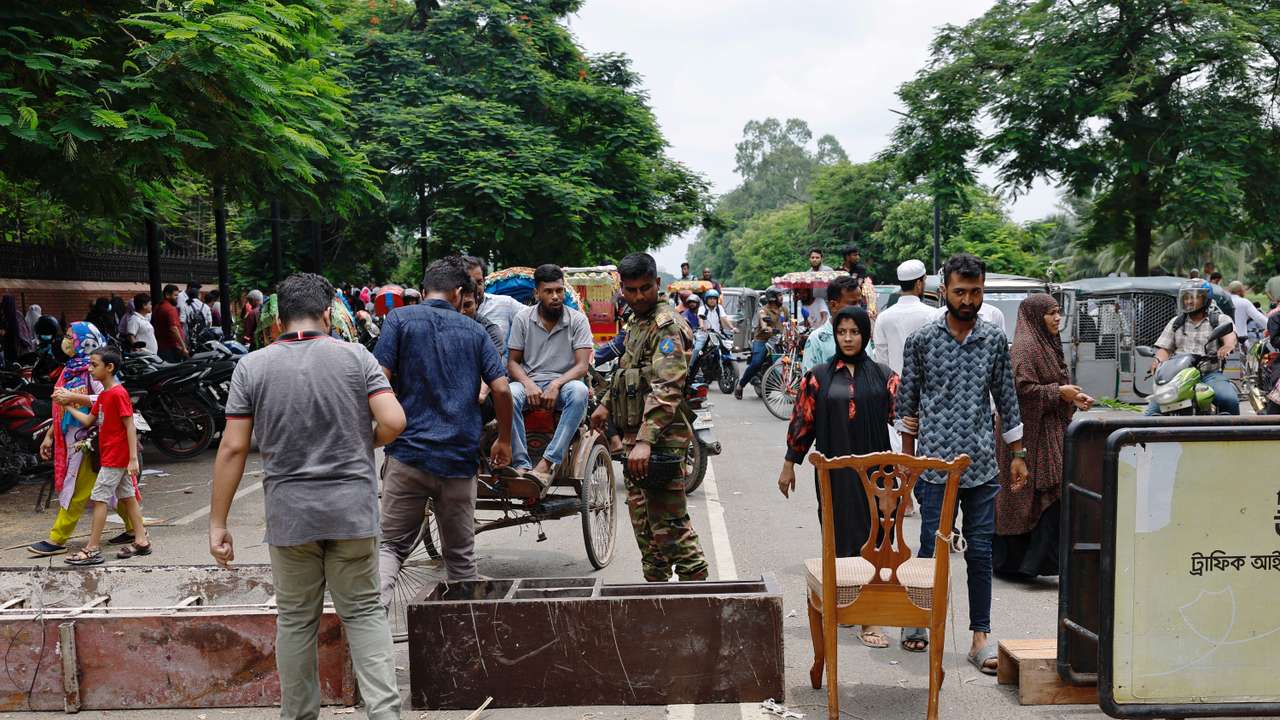 Army member blocks a road at the entrance of the Ganabhaban after Bangladeshi PM Hasina’s resignation in Dhaka