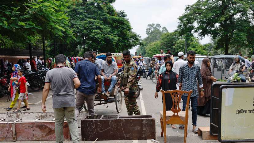 Army member blocks a road at the entrance of the Ganabhaban after Bangladeshi PM Hasina’s resignation in Dhaka