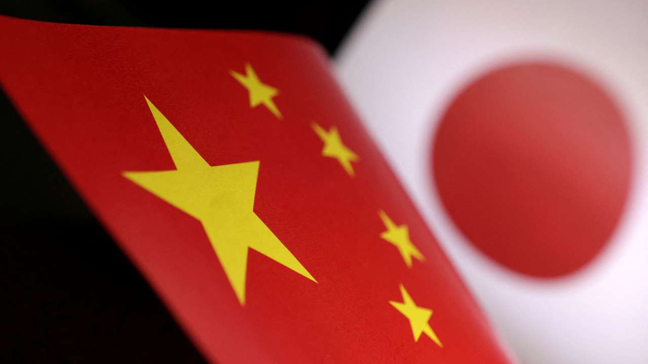 FILE PHOTO: Illustration shows printed Chinese and Japanese flags