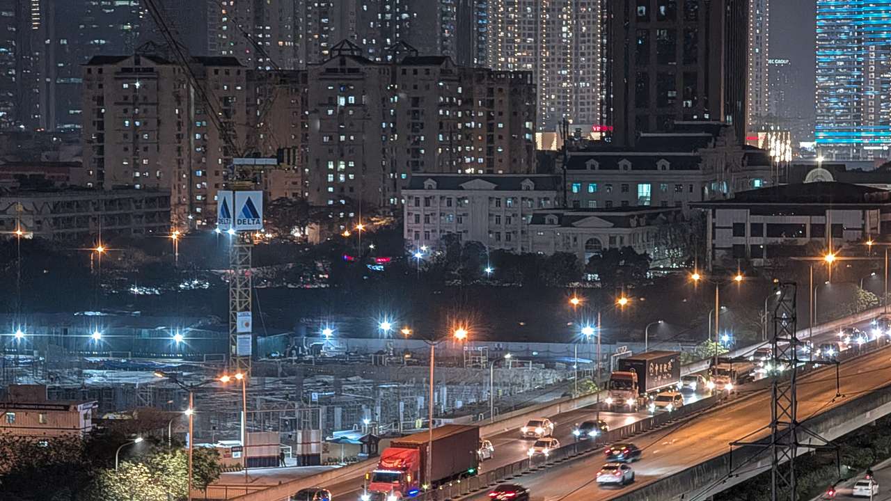 Nighttime Traffic Flows Along An Elevated Highway In Hanoi