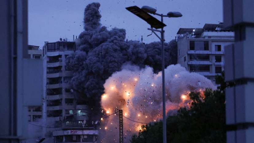 Smoke and flames rise after an Israeli strike, in the Chiyah district of Beirut's southern suburbs