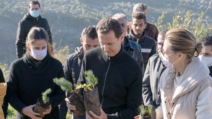 FILE PHOTO: Syria's President Bashar al-Assad and his wife Asma, plant trees in city of Draykish