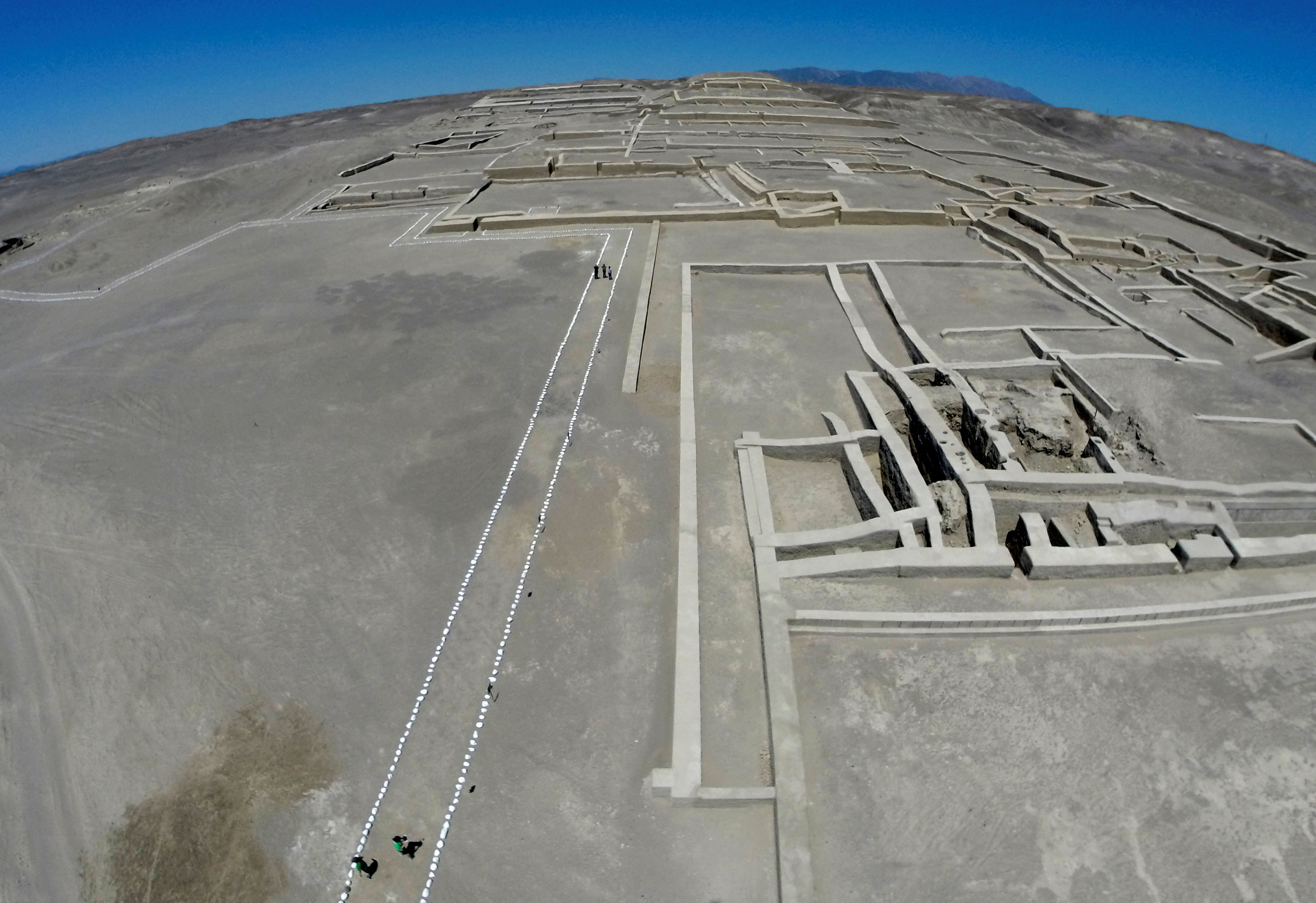 FILE PHOTO: Tourists walk at the Great Pyramid at the Cahuachi Ceremonial Centre in Nazca