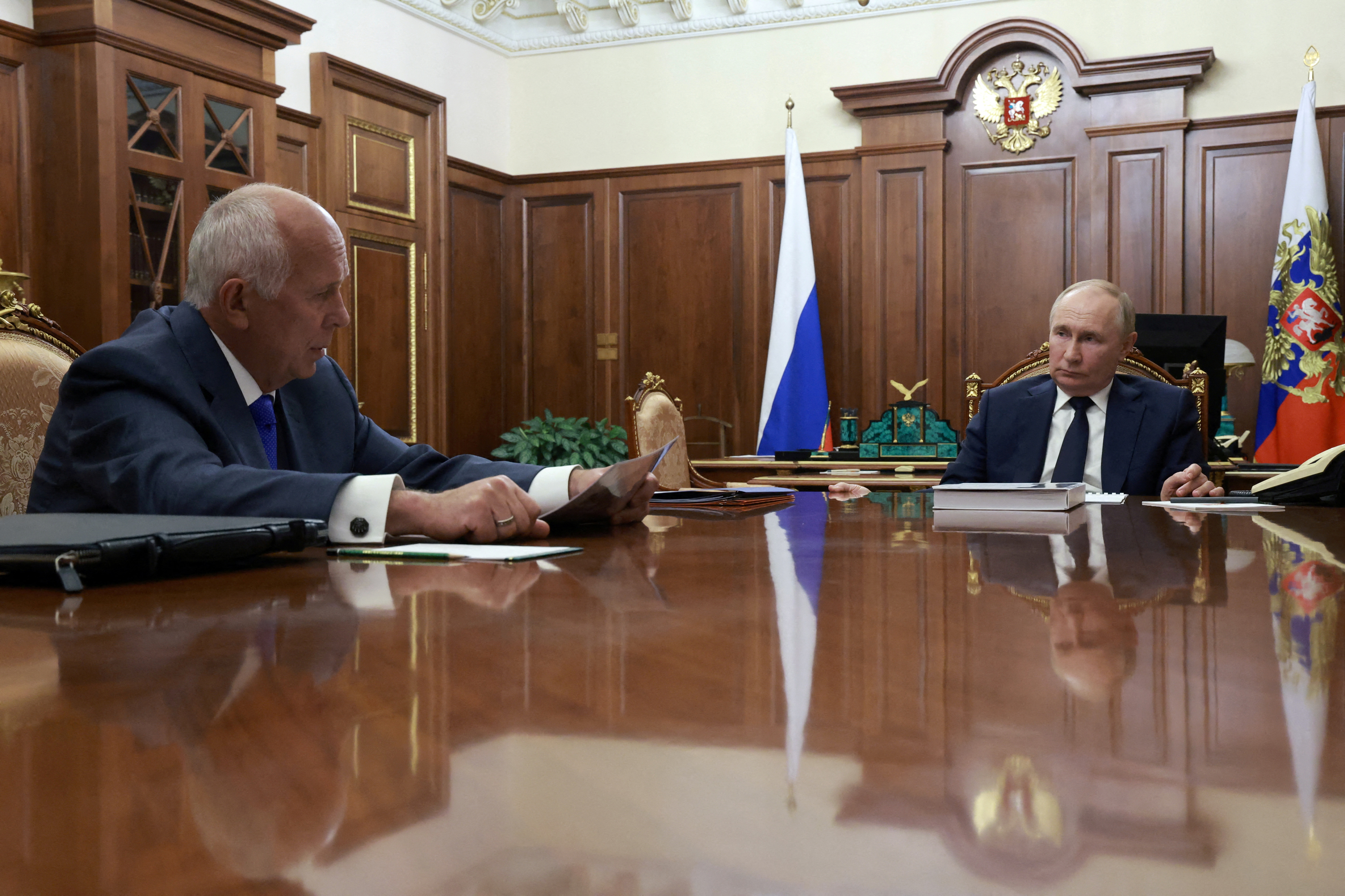 FILE PHOTO: Russian President Putin and Rostec CEO Chemezov meet in Moscow