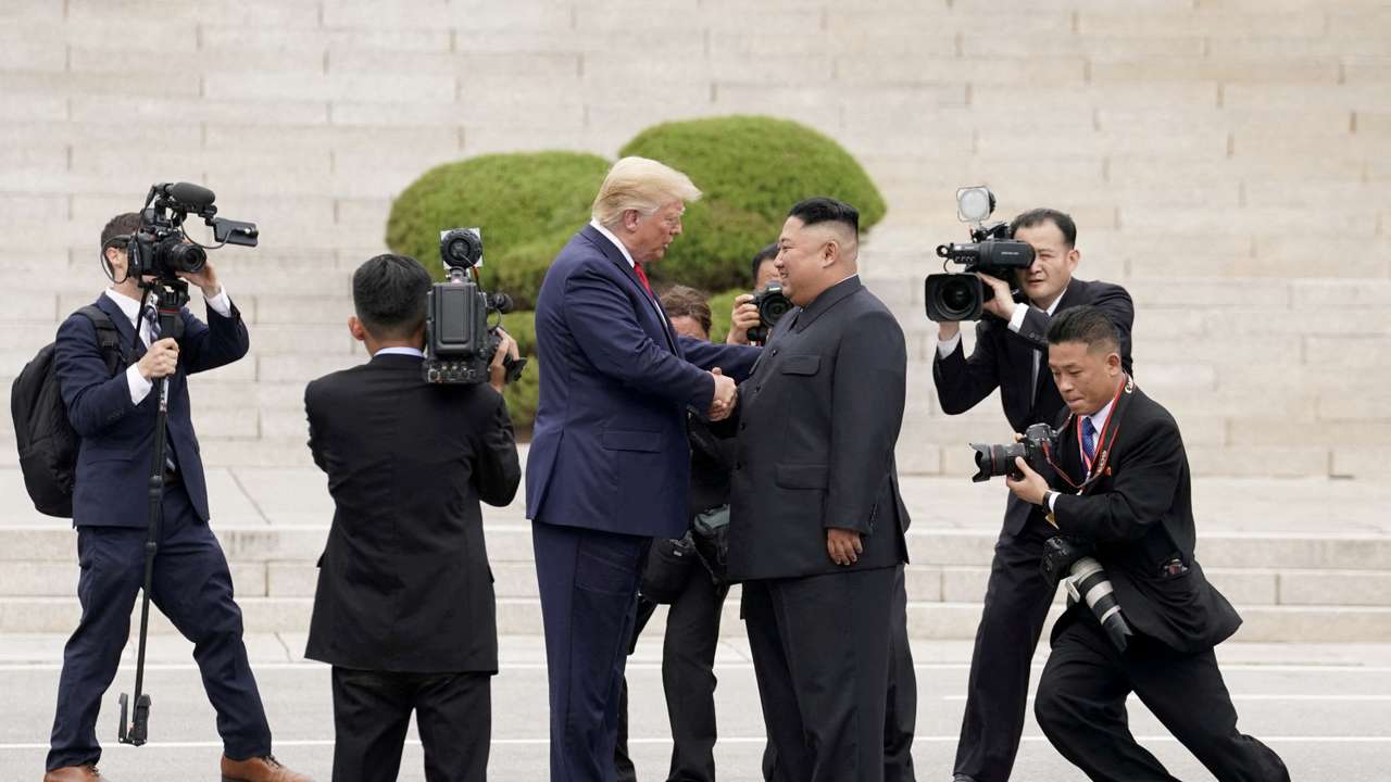 FILE PHOTO: U.S. President Donald Trump meets with North Korean leader Kim Jong Un at the demilitarized zone separating the two Koreas, in Panmunjom, South Korea, June 30, 2019