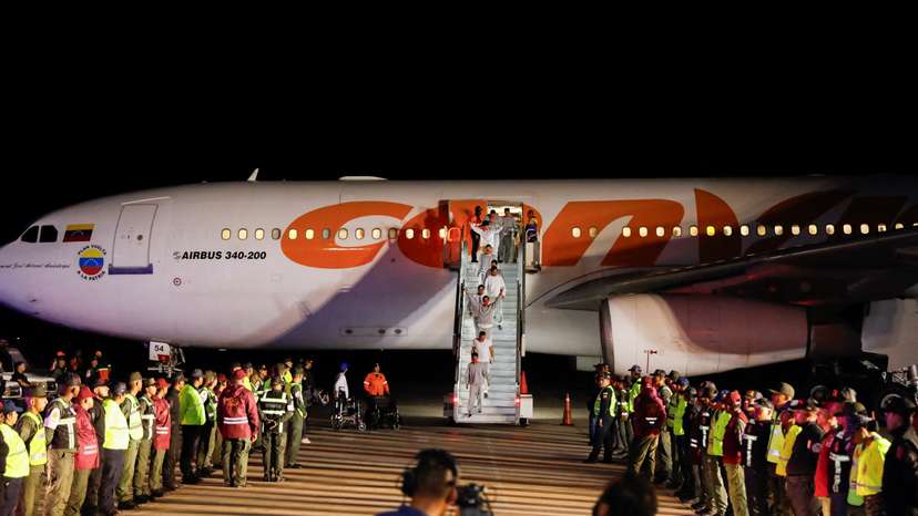 Venezuelan migrants flown home from Guantanamo Bay via Honduras, arrive on a deportation flight at Simon Bolivar International Airport in Maiquetia