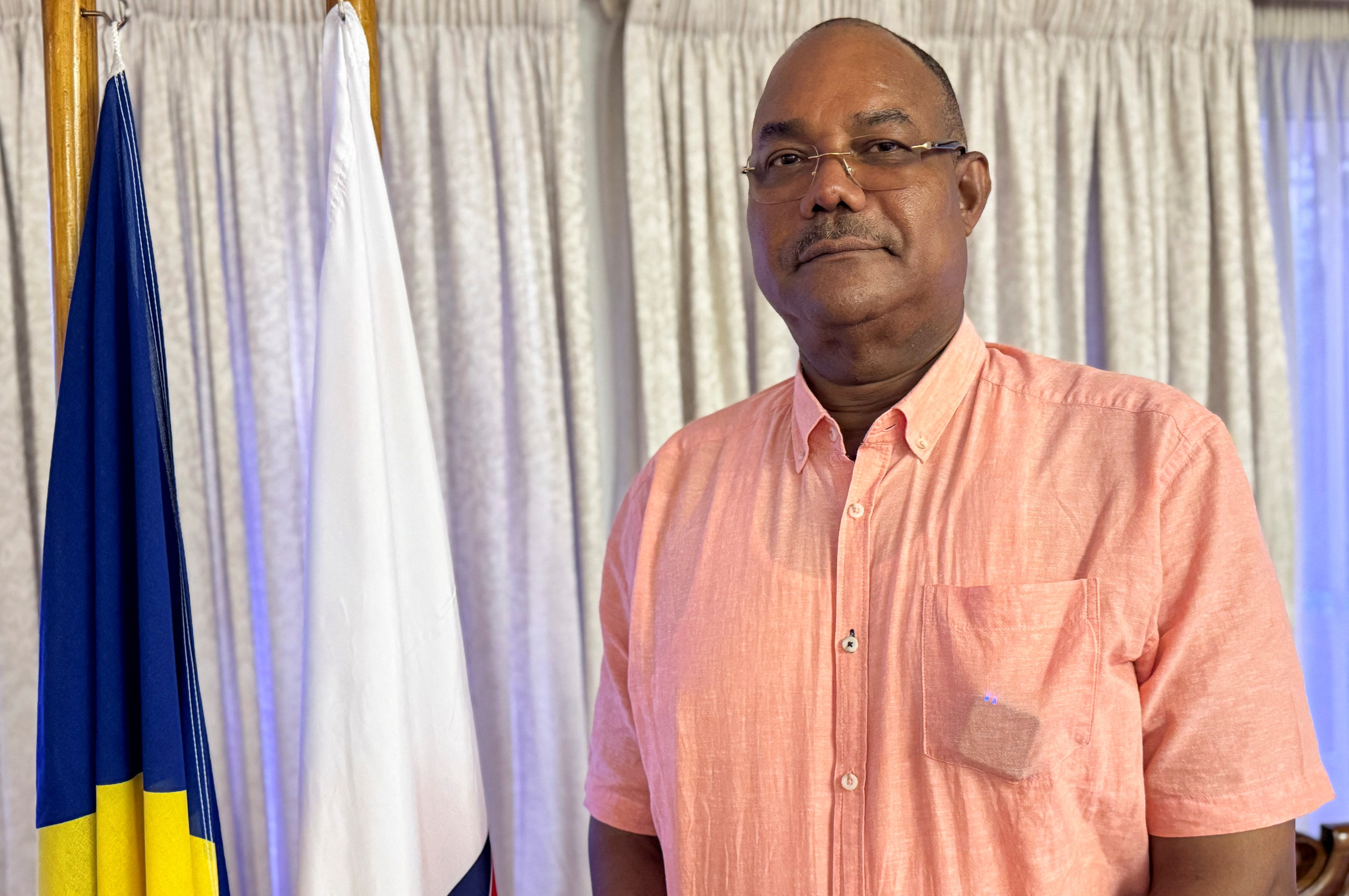 Leader of the United Seychelles (US) party Patrick Herminie poses for a photograph after a Reuters interview ahead of the upcoming general elections in Victoria, Seychelles