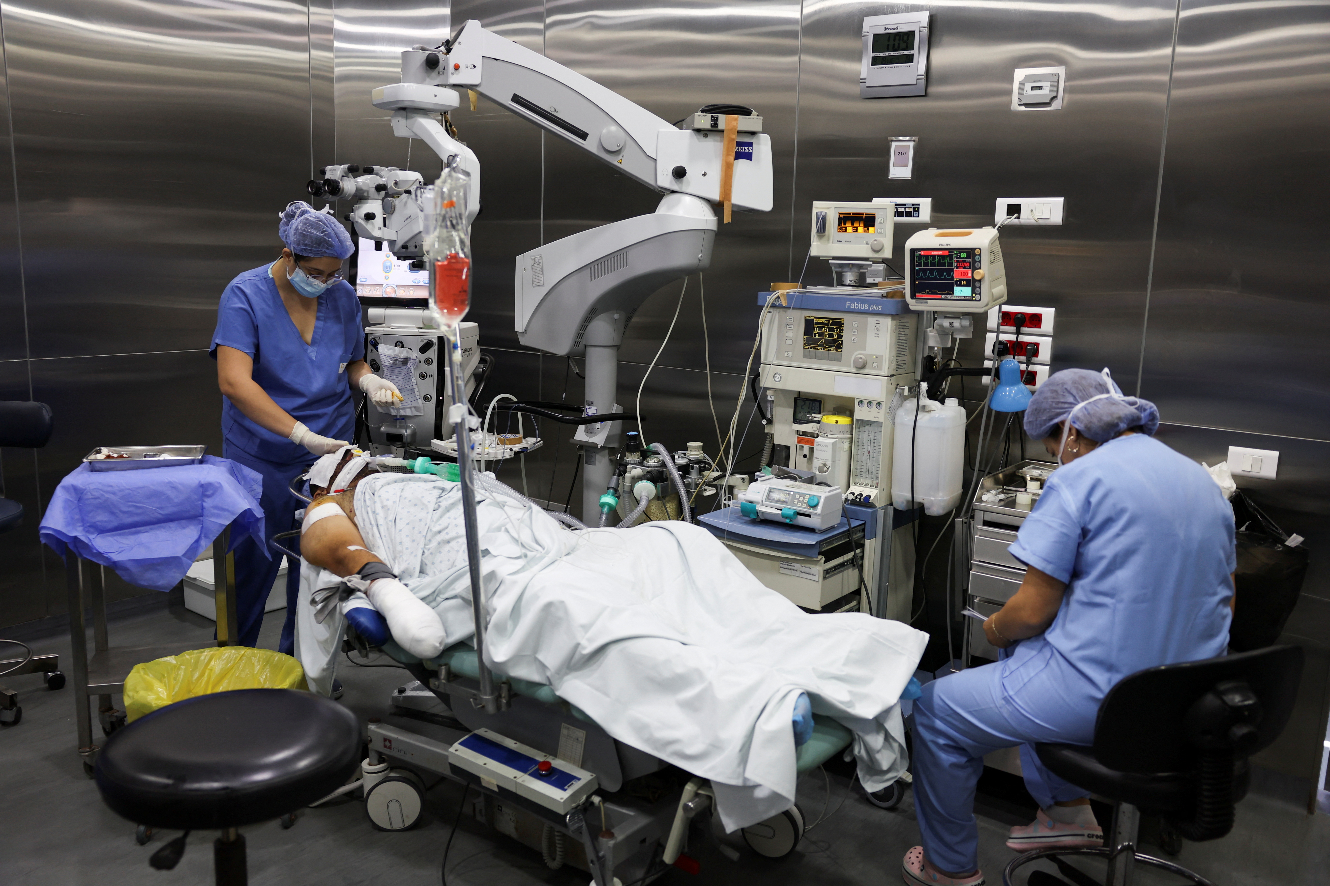 An injured man undergoes an operation, following pager detonations across Lebanon, at a hospital in Beirut