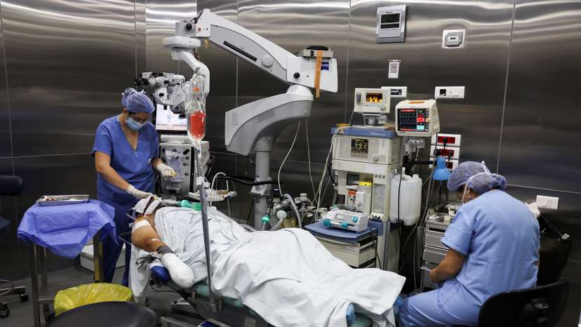 An injured man undergoes an operation, following pager detonations across Lebanon, at a hospital in Beirut