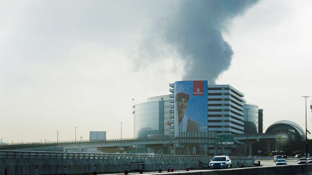 Smoke rises from the Dubai International Airport