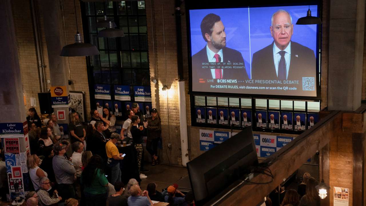 People watch the Vice Presidential debate, in St. Paul