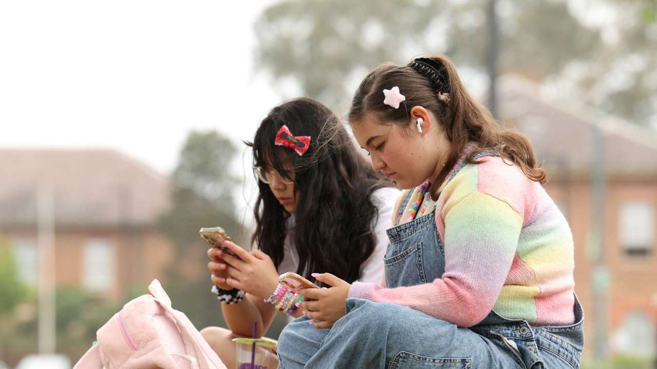 Teens discuss Australia’s social media ban for under-16s, set to take effect December 10, in Sydney