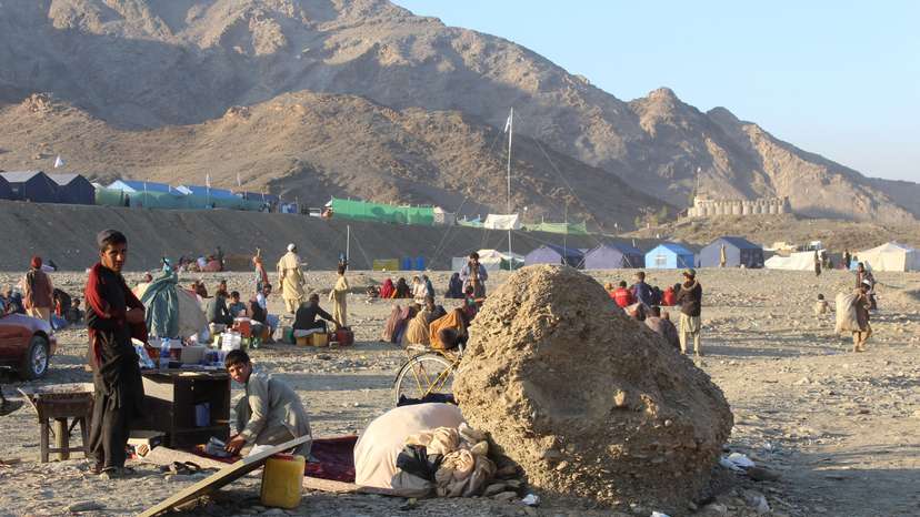 Afghan nationals rest at a camp after returning from Pakistan at Torkham border crossing