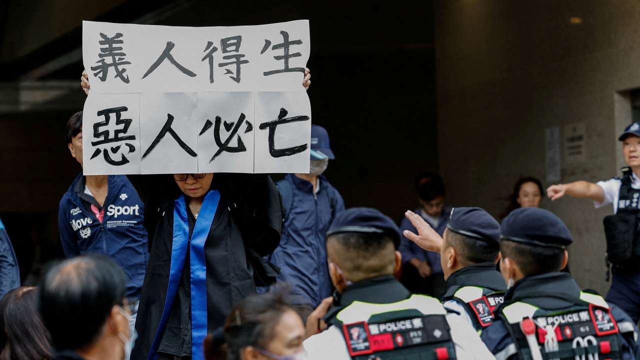 FILE PHOTO: Scenes from outside the West Kowloon Magistrates’ Courts building after the sentencing of 45 convicted pro-democracy activists charged under the national security law, in Hong Kong