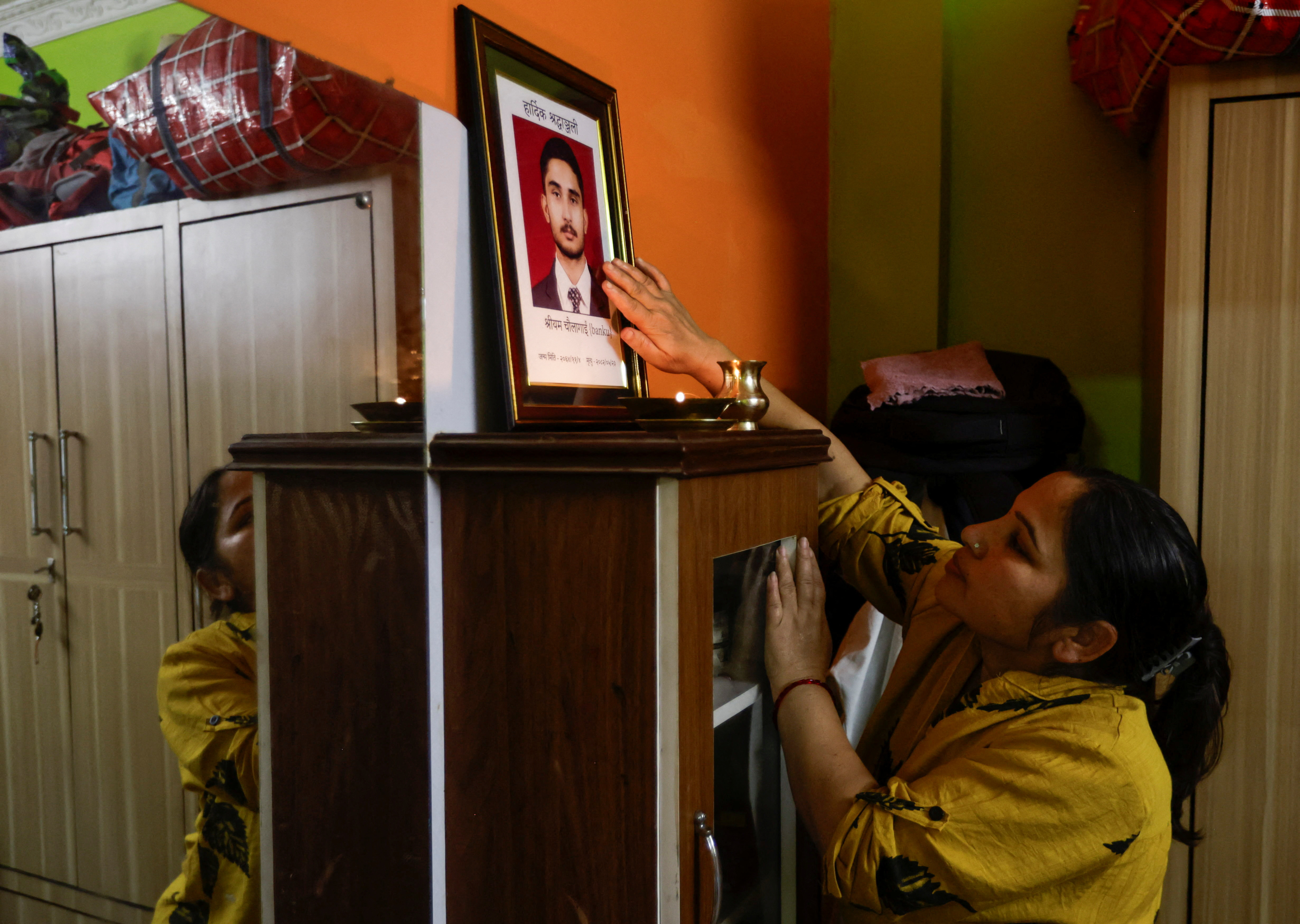 Nepal families mourn their dead in protest as the nation celebrates annual festival
