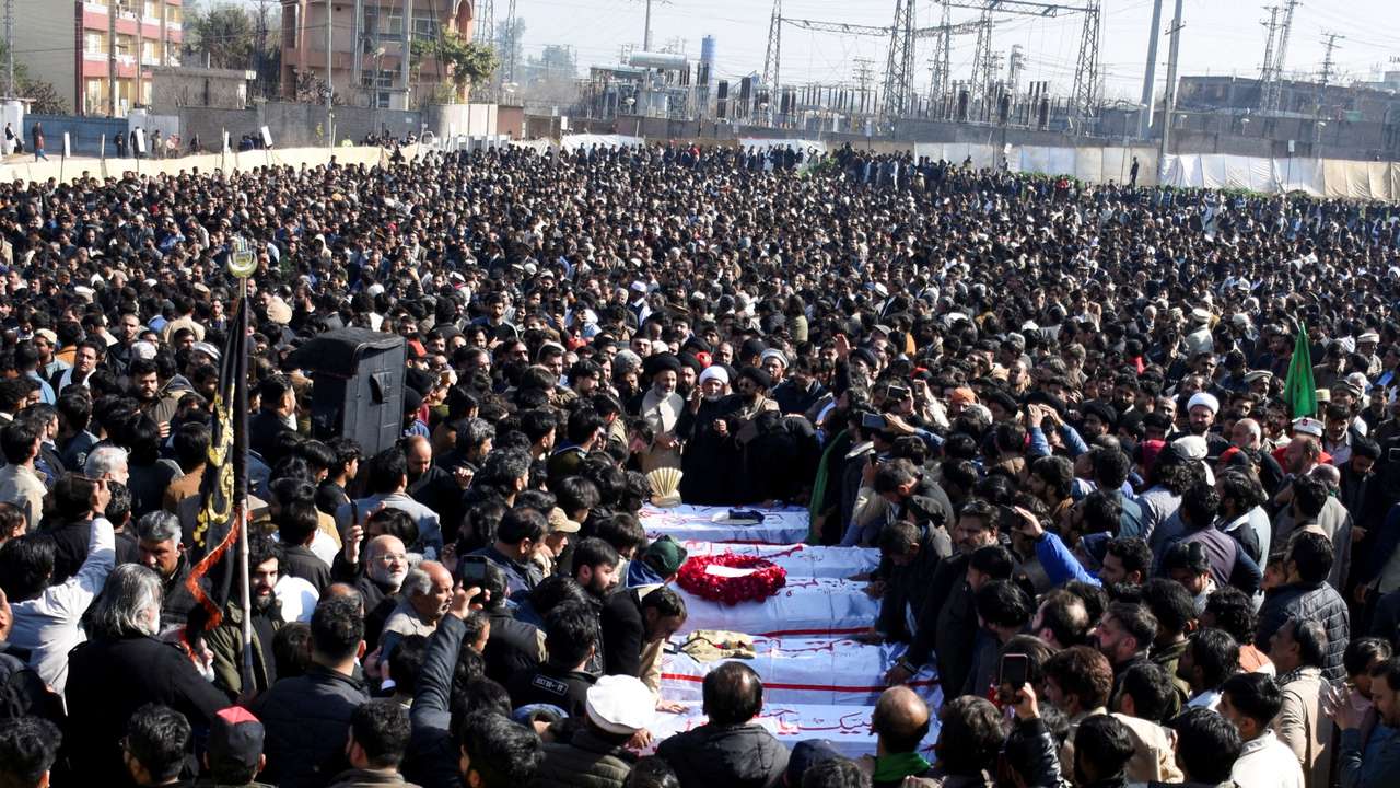 People attend funeral of victims following the suicide explosion at a Shi'ite Muslim mosque, in Islamabad