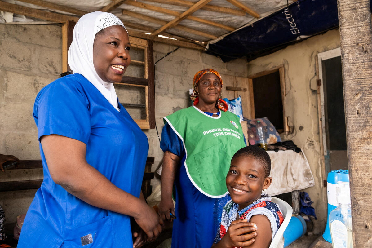 A girl reacts after receiving the HPV vaccine in Lagos State