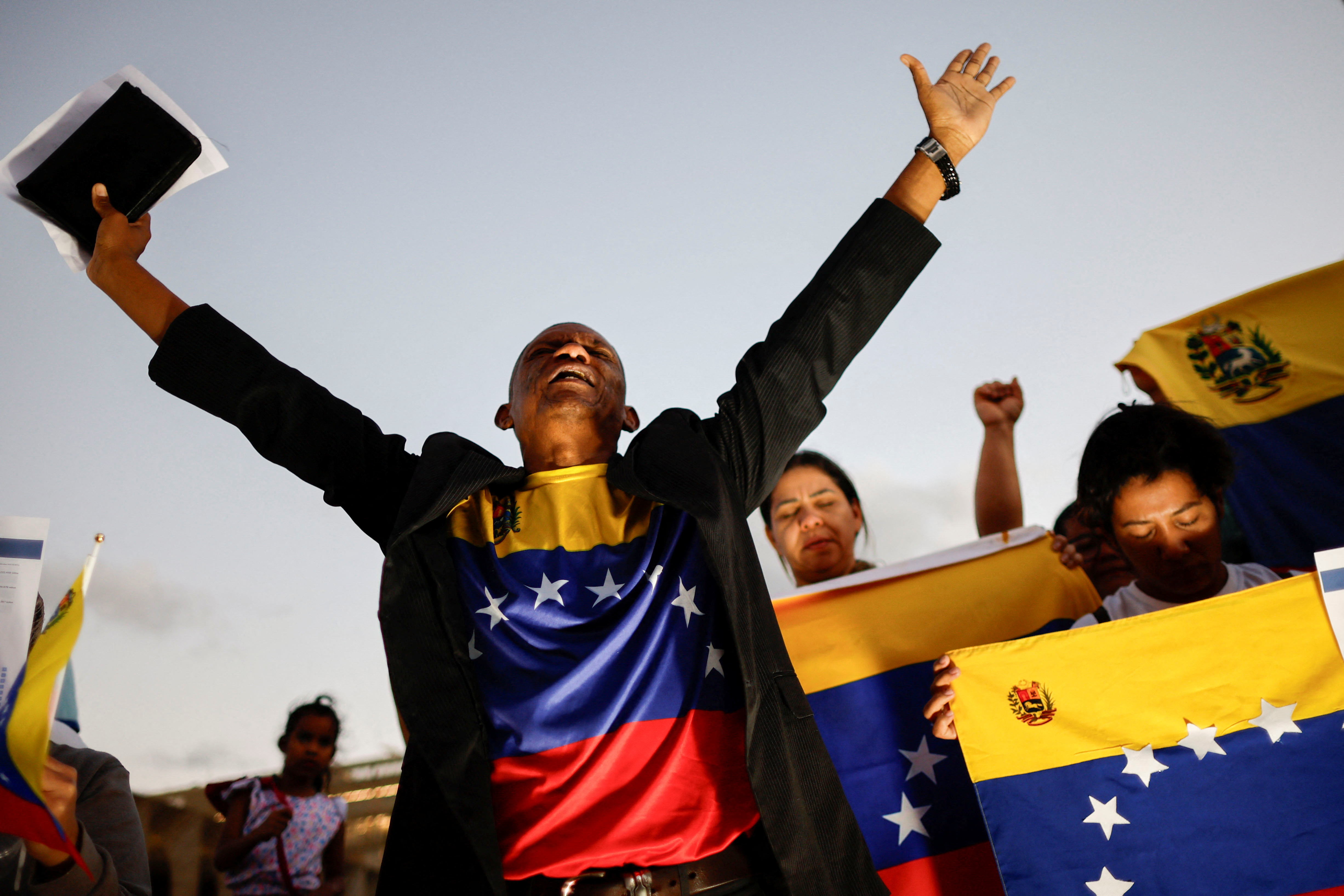 Venezuelan citizens take part in a protest against the electoral results that awarded Venezuela's President Nicolas Maduro, in Brasilia