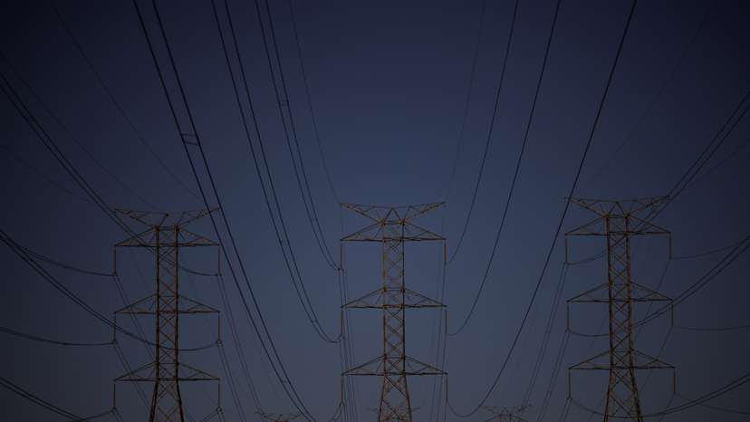 Pylons of high-tension electricity power lines are seen during sunset in Brasilia