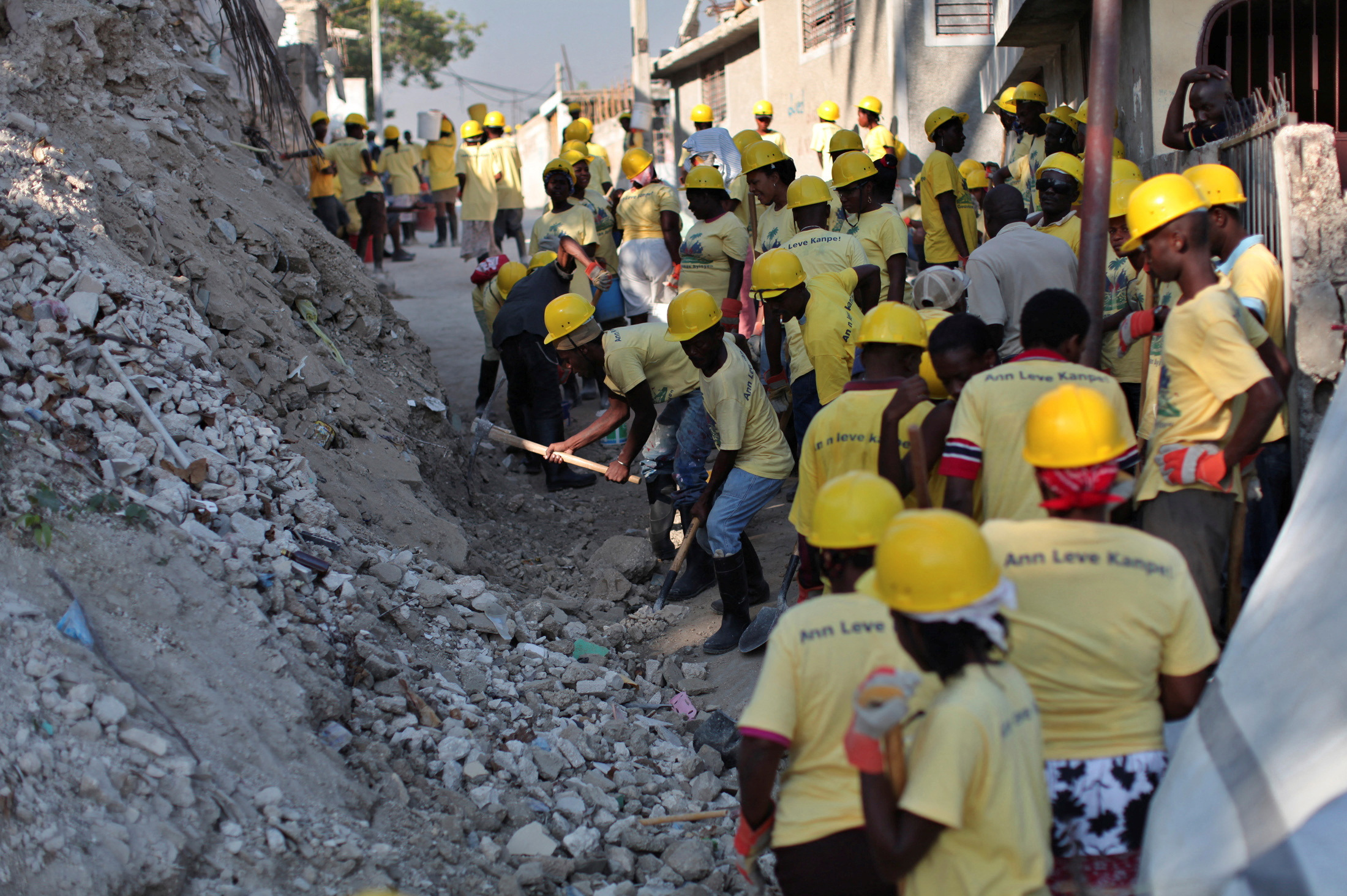 FILE PHOTO: Provisional workers of USAID and DAI remove debris from the January 2010 earthquake in Port-au-Prince