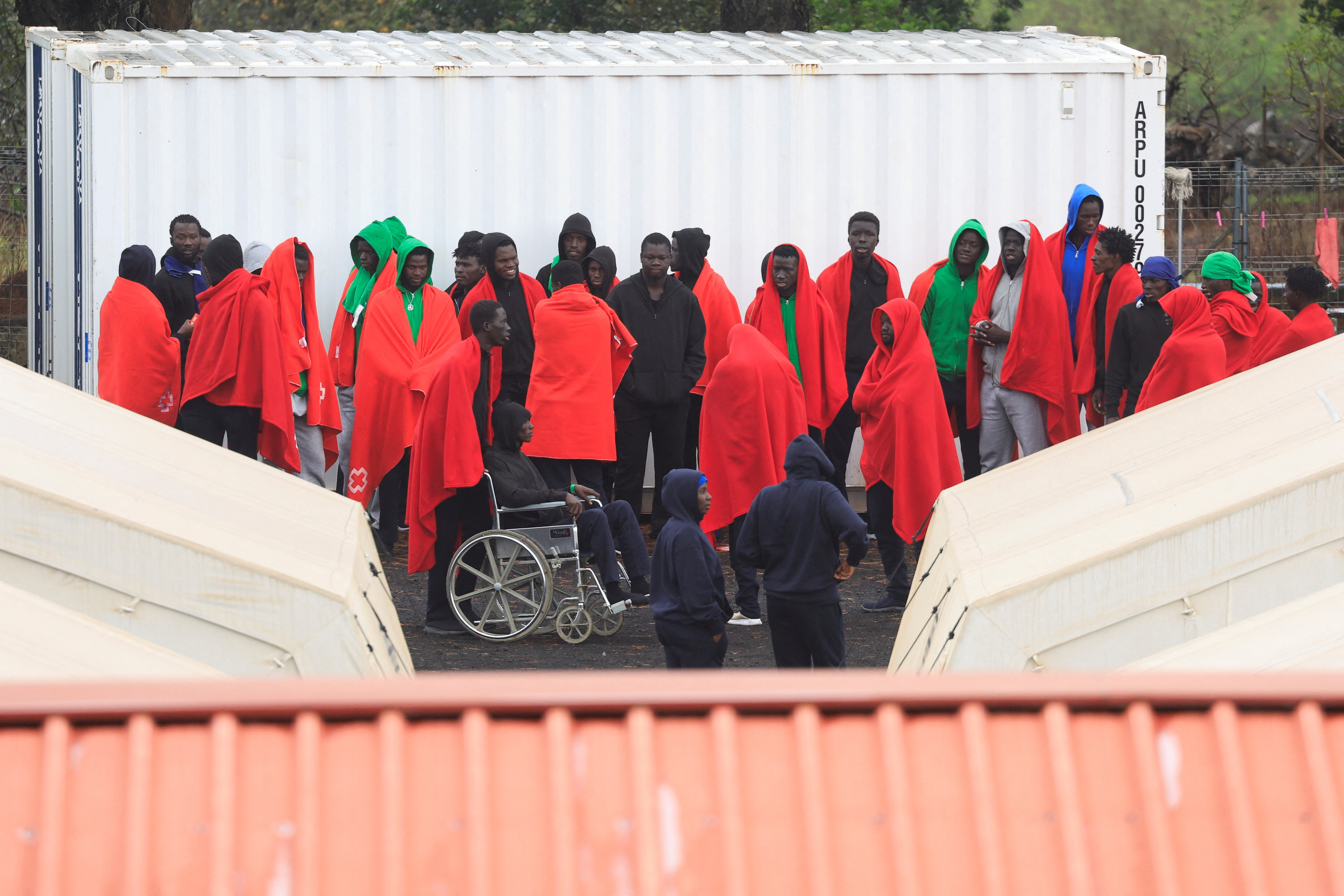 Migrants gather at the CATE (temporary assistance center for foreigners) in San Andres on the island of El Hierro