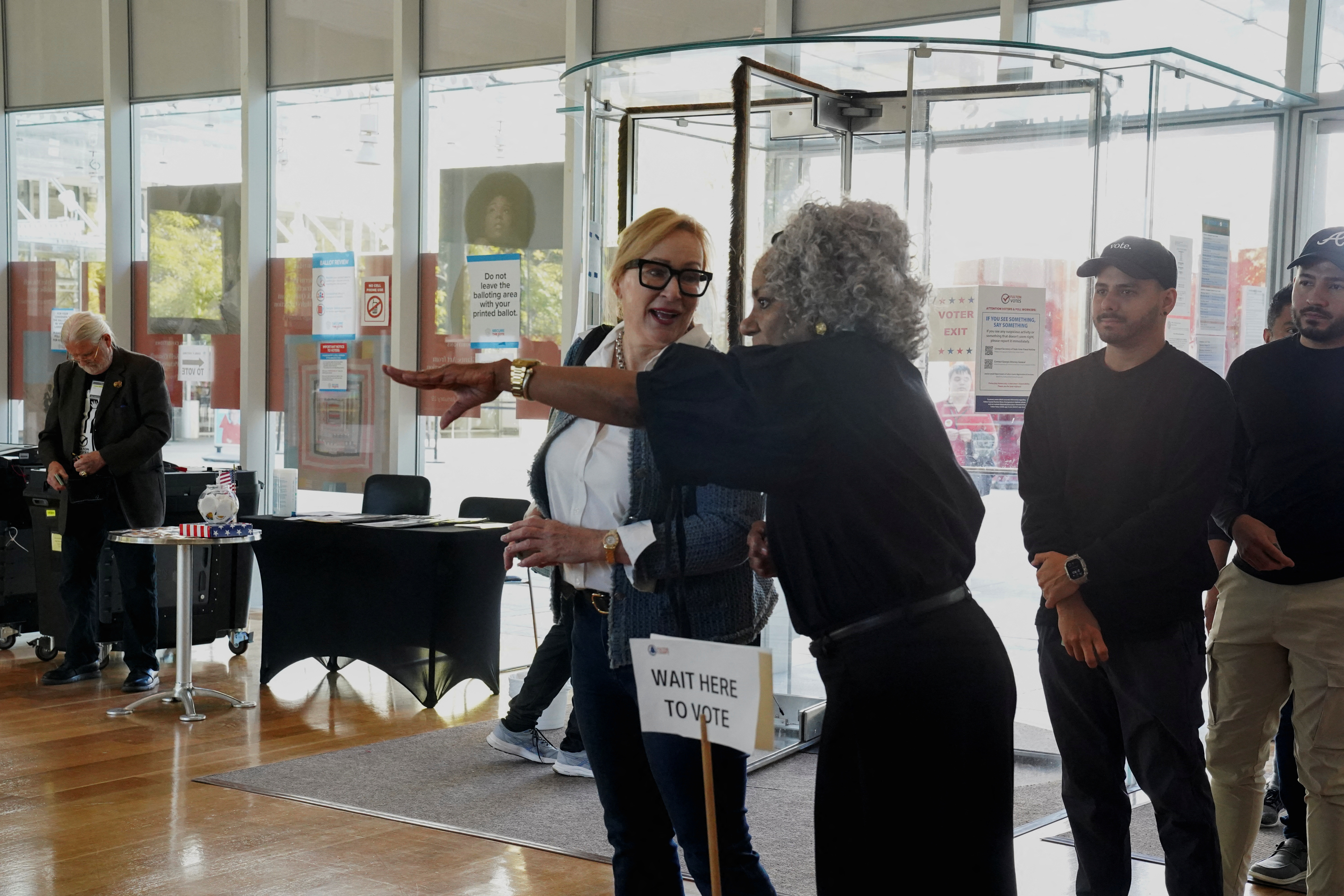 Voters line up to enter a polling station as Georgians turned out for early voting