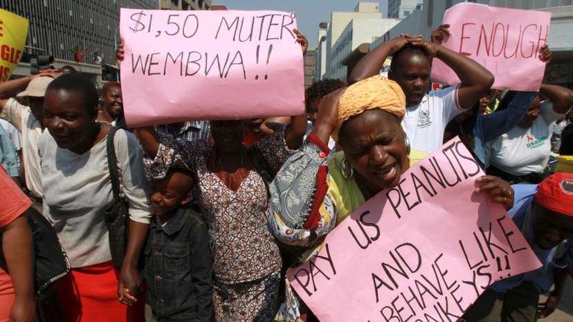 Civil servants and teachers march during a protest for better wages and working conditions in Harare