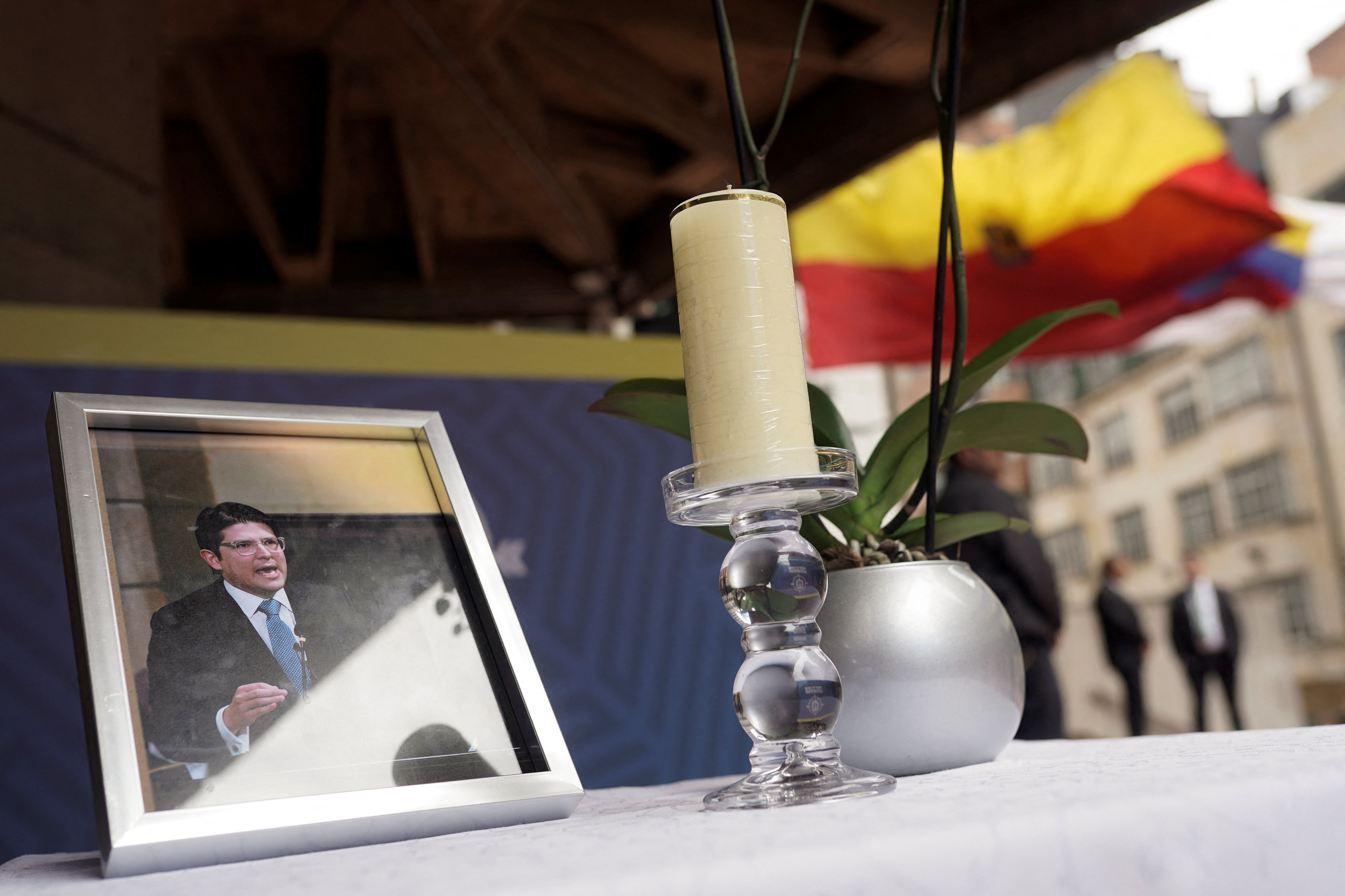Government employees attend a ceremony for late Colombian Senator Miguel Uribe, in Bogota