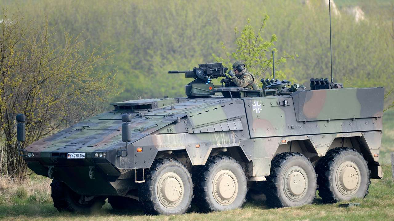 A German soldier reloads a heavy machine gun of an armoured fighting vehicle Boxer during a presentation of German army Bundeswehr in Putlos