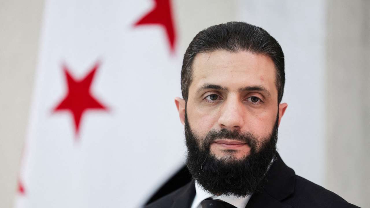 Syria’s interim President Ahmed al-Sharaa attends an interview with Reuters
